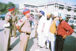 The SAD youth-wing activists raise slogans before being produced in a city court