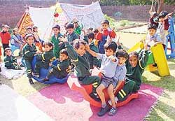Tiny tots of Dikshant International School enjoy camping as part of the Children’s Day celebrations in Phase-I, Industrial Area, Panchkula, on Thursday.