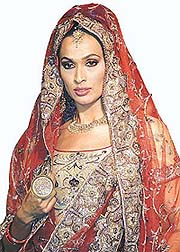 Designers are celebrating the wedding season with bright oranges, reds and maroons