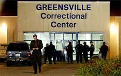 Spokesman Larry Traylor looks at a statement confirming the execution of Aimal Kasi at the Greensville Correctional Centre, Jarratt, Virginia