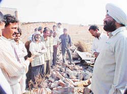 Mr Nahar Singh Gill, Mayor, Ludhiana, listen to grievances of persons whose plots were occupied by the administration after demolishing the outer walls of these plots
