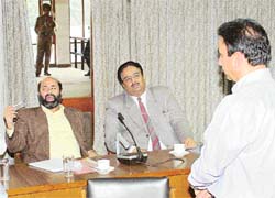 Mr Vikram K. Chand, team leader of the Economic Mission of the World Bank, and Mr Sarvesh Kaushal, Secretary, Local Government, Punjab, listen, while Mr S.K. Sharma, MC Commissioner