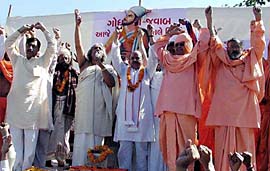 VHP leaders Pravin Togadia (fourth from right) and Acharya Dharmendra and others activists shout slogans