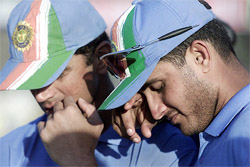 Captain Saurav Ganguly and vice-captain Rahul Dravid listen to the awards ceremony after losing the fifth one-day international