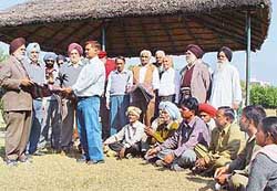 Residents of Sector 15 distribute blankets among gardeners to celebrate the birth anniversary of Guru Nanak Dev