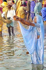 A woman offers prayers
