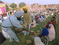 Devotees partake of langar
