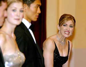 Pop star Madonna waits in line to meet Britains Queen Elizabeth