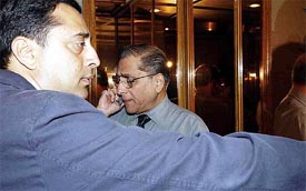 BCCI chief Jagmohan Dalmia talks on his mobile phone