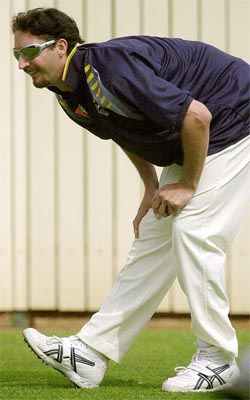 Australias fast bowler Jason Gillespie stretches his leg