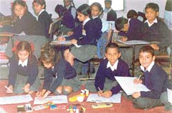 Children participate in a painting competition organised by the Army in connection with Communal Harmony Week celebrations 