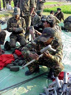 Army jawans check equipments before the start of a demine operation