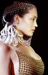 A Chinese model displays a crystal dress and headdress
