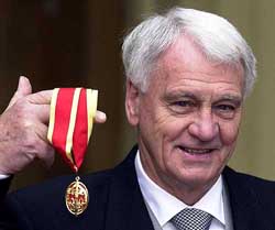 Newcastle United football manager Sir Bobby Robson poses for photographers