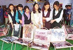 Tibetan girls at a photo exhibition on sufferings of the Tibetans in Balmiki Bhavan, Sector 24, Chandigarh, on Saturday