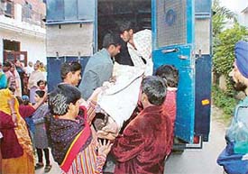 The body of Bharti, who was found dead in her Sector 38 residence, being taken away by the police 
