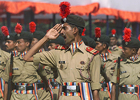 NCC cadets shout as they form an honour guard