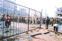 An iron gate put up by a builder in the presence of PUDA officials on the extended boundary of land towards the old GT Road