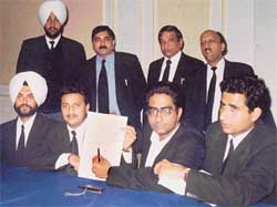 Members of the Organisation of Young Lawyers show the list of fake votes at a press conference