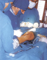Orthopaedic specialists performing a surgery