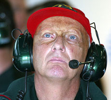Niki Lauda looks up in the Jaguar pit during a training session for the Austrian F1 Grand Prix 