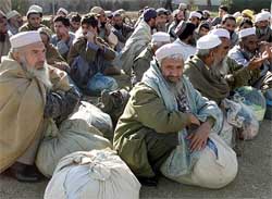 Pakistani prisoners released by the Afghan authorities await their paper work on the grounds
