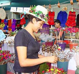 A Naga woman admiring dry flowers at a stall in the ongoing Crafts Bazar in Guwahati