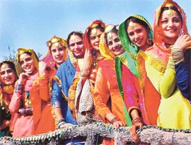 Punjabi belles attired in traditional dresses during a round of the Miss World Punjaban-2002 contest