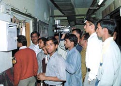 People peep into the room in which the girl was shot at in Bhikaiji Cama Place