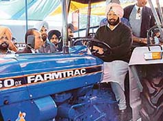 Punjab Chief Minister Amarinder Singh on a tractor at Agro-Tech-2002 