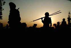 Indian soldiers make their way back to their base