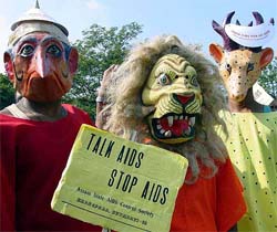 Members of the Global Organization for Life Development wearing masks join in a rally