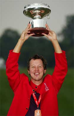 Fredrik Jacobson of Sweden holds aloft his trophy