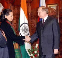 Mr Putin shakes hands with Congress President and Leader of the Opposition in the Lok Sabha Sonia Gandhi