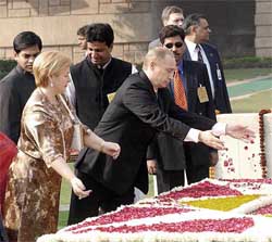 Mr Putin and his wife Lyudmila Putin pay homage at the samadhi of Mahatma Gandhi 