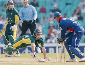 Australia A batsman Brad Hogg is airborne