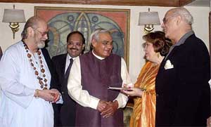 Prime Minister Atal Behari Vajpayee receives a copy of Raj Kapoor speaks from author Ritu Nanda