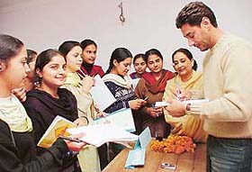 Harbhajan Mann gives autographs to fans at the inauguration of the film and TV Academy in Sector 35