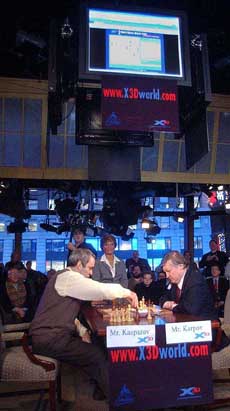 Garry Kasparov makes a move during a chess match