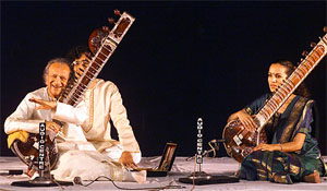Indian sitar maestro Pundit Ravi Shankar performs with his daughter