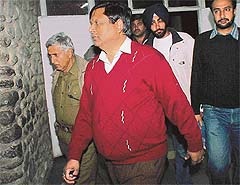 Haryana bureaucrat N.K. Jain, accused of framing a city industrialist in a rape case, being taken to General Hospital