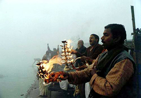 Devotees perform aarti on the banks of the Ganga river
