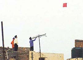 Unmindful of their safety, children fly kites on the rooftop, in Ludhiana
