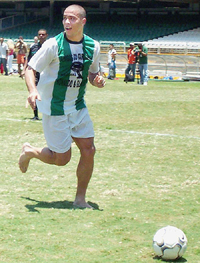 Playing barefooted Real Madrids Brazilian soccer star Ronaldo Nazario controls the ball during a match with his friends 