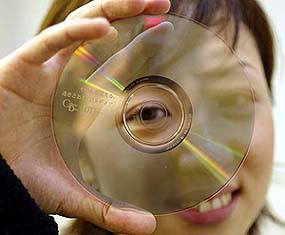 DT Japan Inc employee Yoshino Akachi shows off a C-thru Disc