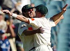 Australia's Jason Gillespie celebrates with teammate Brett Lee