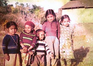 Neetu (wearing a red sweater) with her friends in her past life