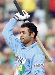Virender Sehwag acknowledges his century during their one-day international against New Zealand 