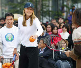 Tennis player Maria Sharapova of Russia plays with a fan