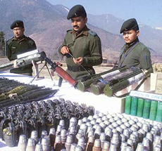 Army officers display arms and ammunition at their headquarters in Trihgam in Kupwara district